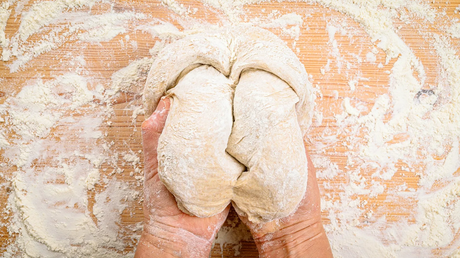 Hands working dough for the future bakery