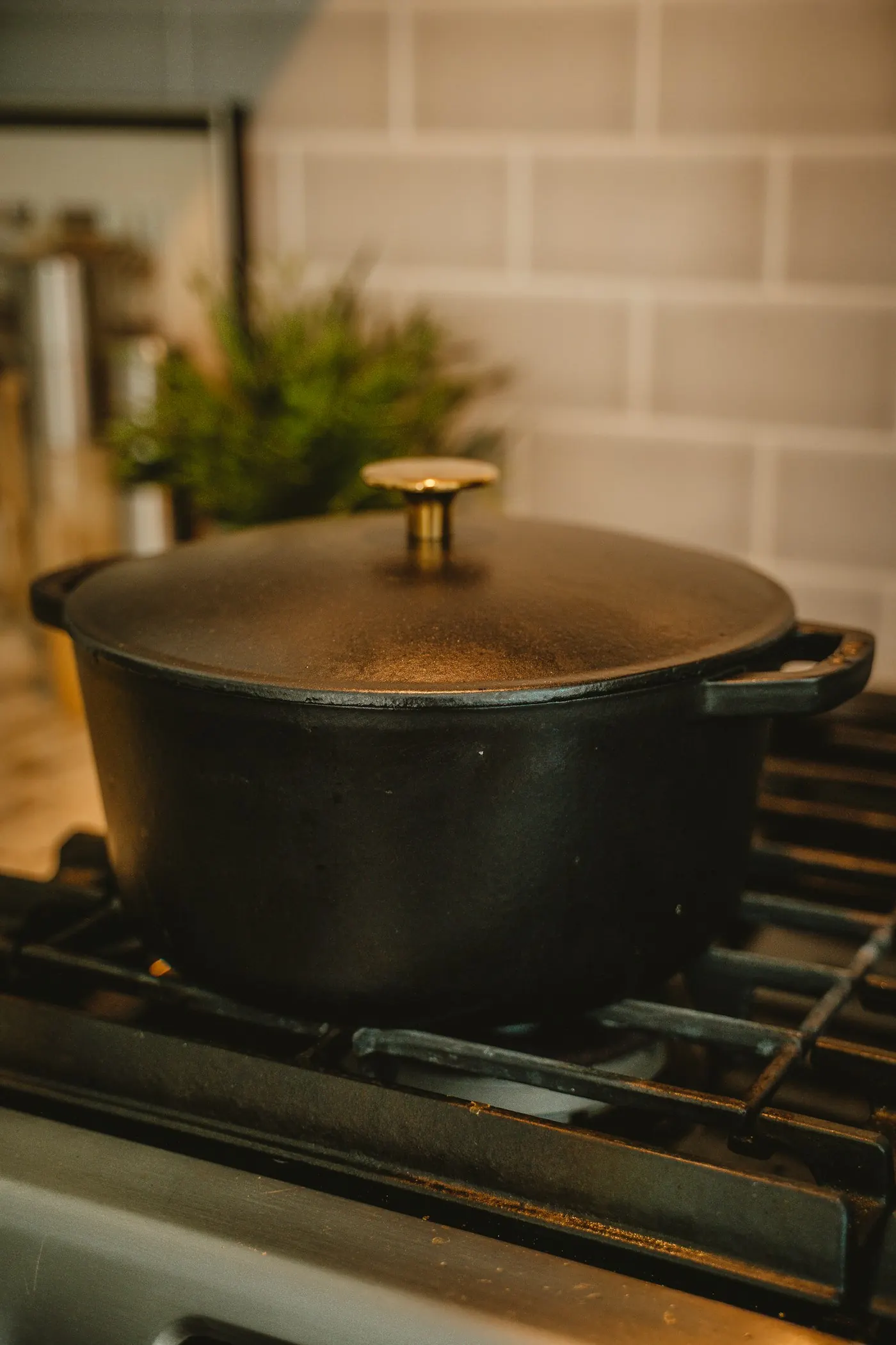 A black cast-iron dutch oven on a stovetop